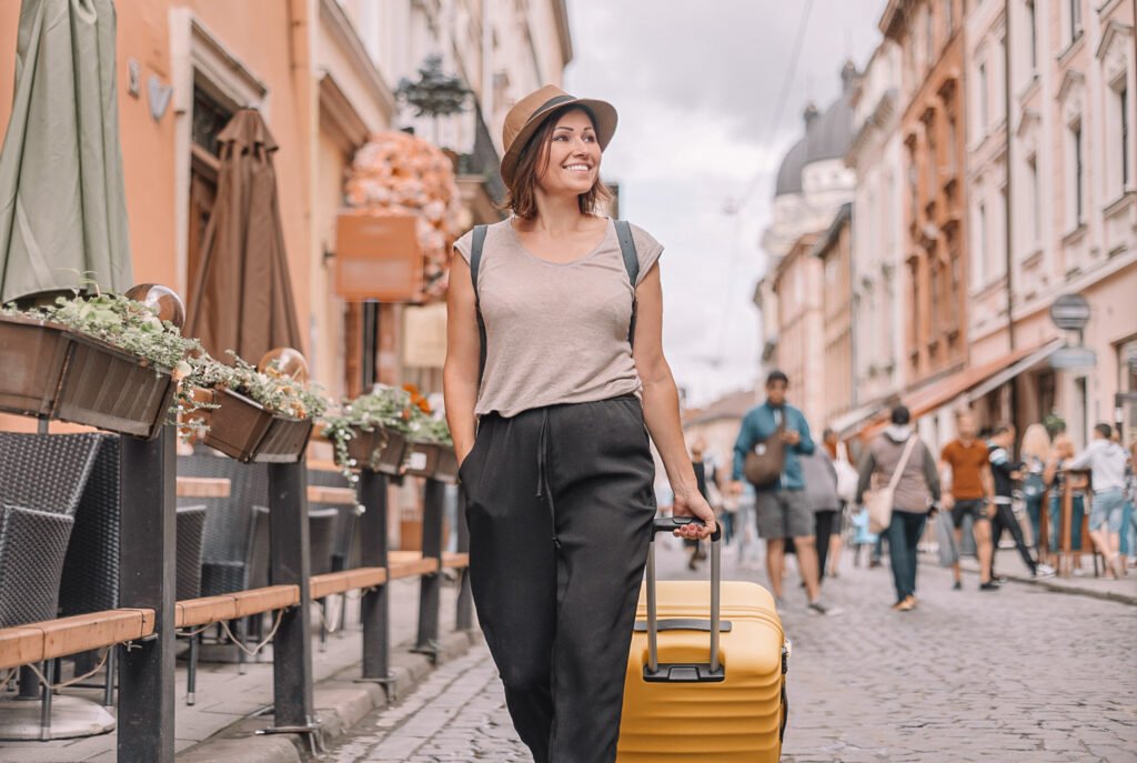 Woman with luggage - city