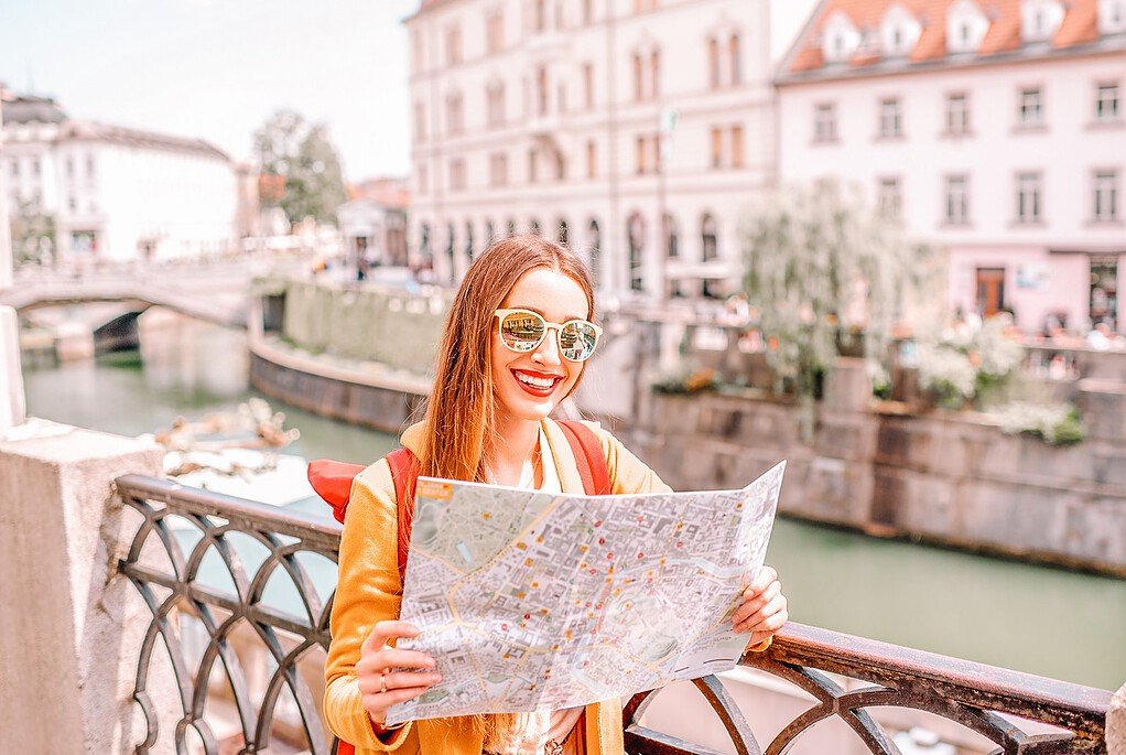 Safest cities in europe for solo female travelers - Ljubljana - Woman with the map