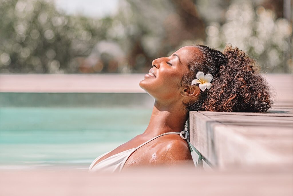 woman in the pool with flower