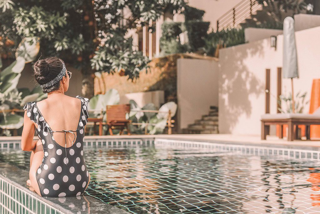 Best Resorts for Solo Female Travelers - woman by the pool
