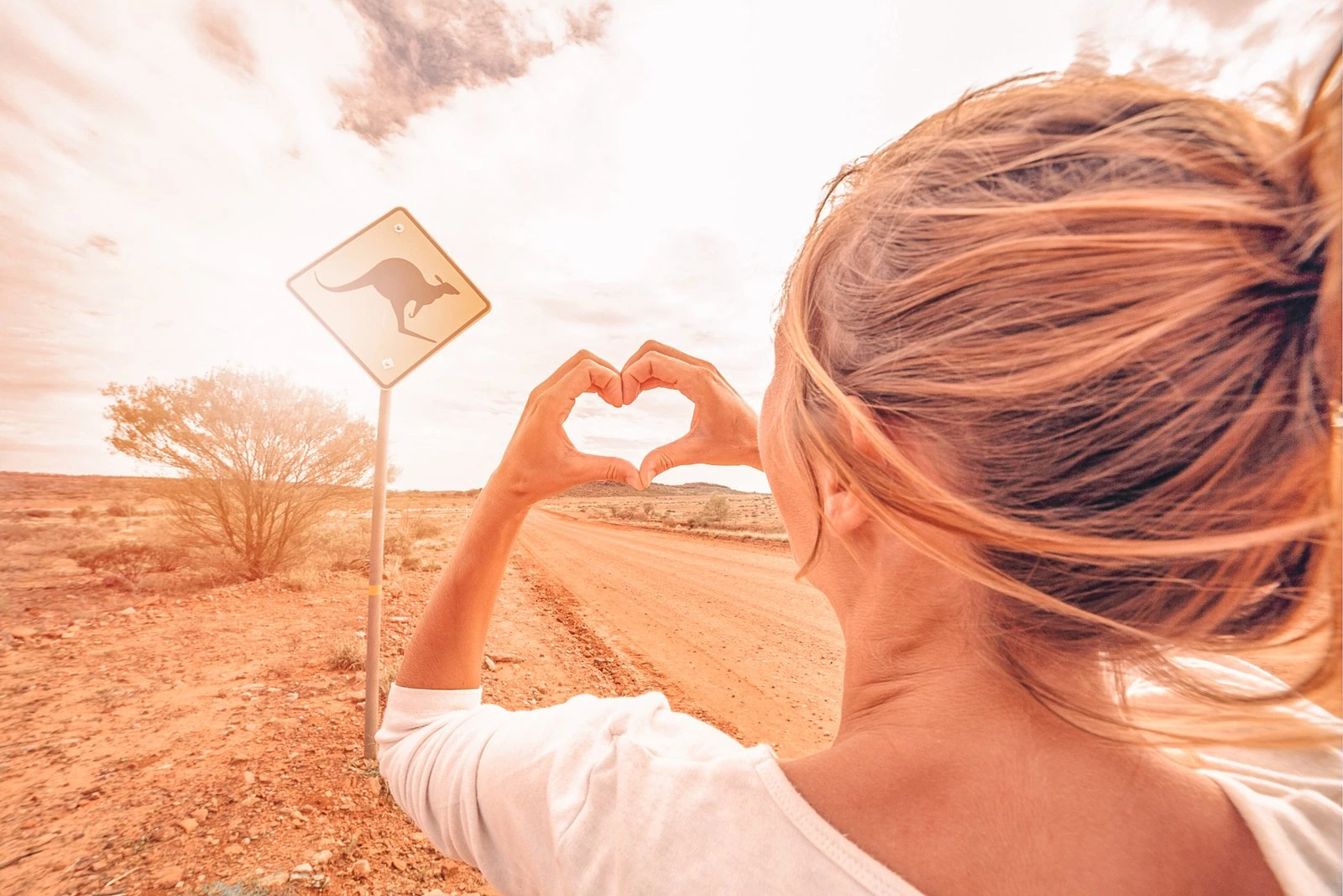 responsible travel - woman doing heard from her hands