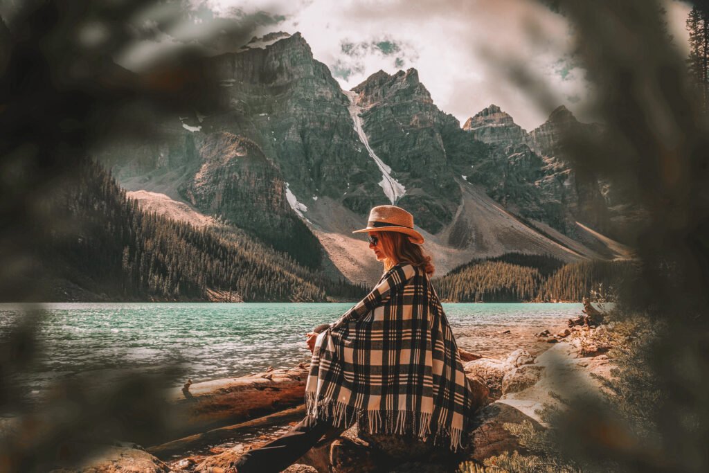 solo female travel in canada - woman by the lake