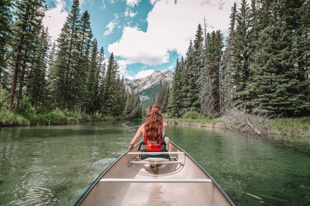 solo female travel in Canada - woman kayaking