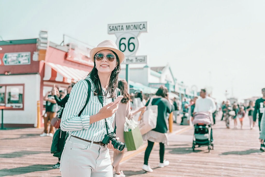 best USA road trips for solo female travelers - woman Santa Monica Pier Route 66